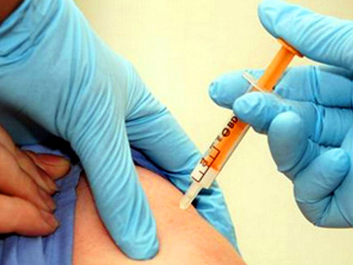 Someone being vaccinated