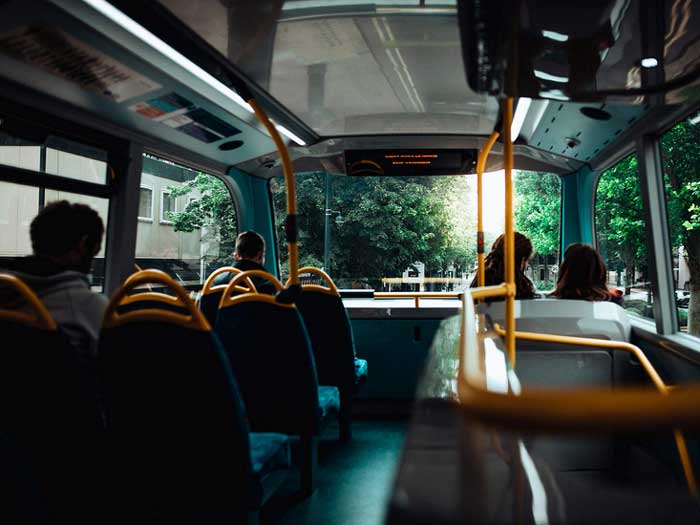 Passengers on the top deck of a bus